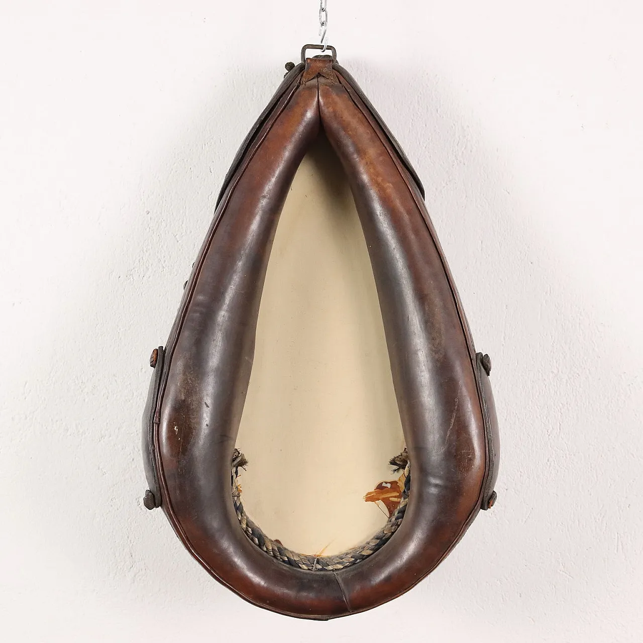 Mirror inside a leather riding saddle with studs 9