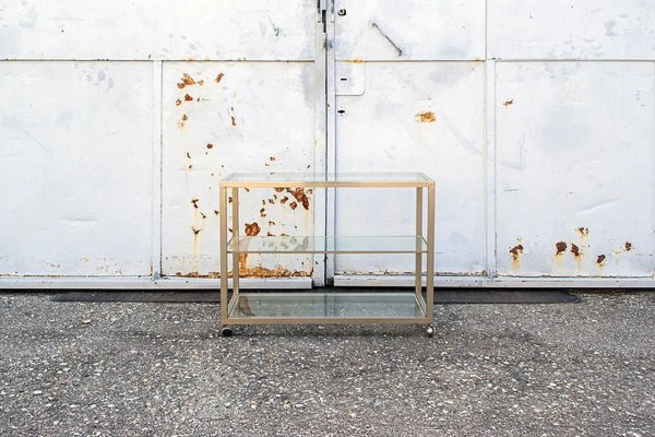 Consolle in ottone e vetro con rotelle, anni '70 1