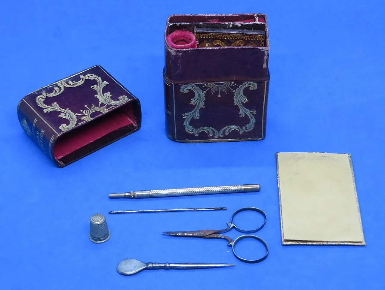 Tooled maroon leather sewing set, 19th century 11