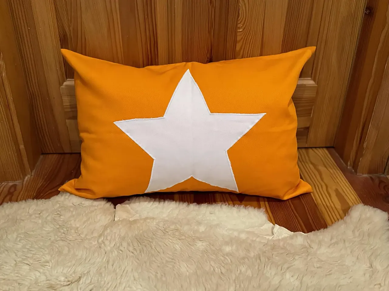 Yellow fabric pillow with white star, 2000s 2
