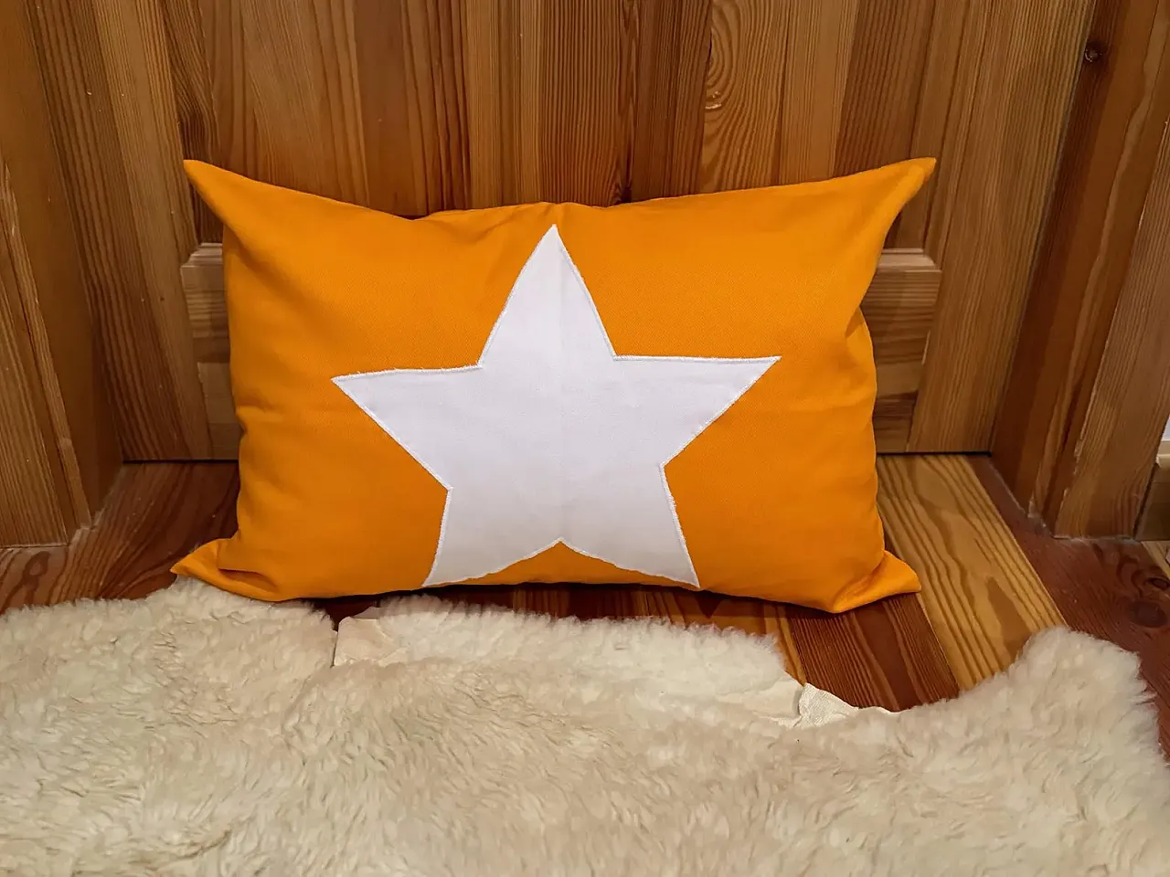 Yellow fabric pillow with white star, 2000s 6