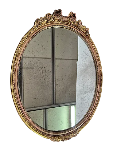 Specchio ovale in legno intagliato e dorato a mano, primi ’800