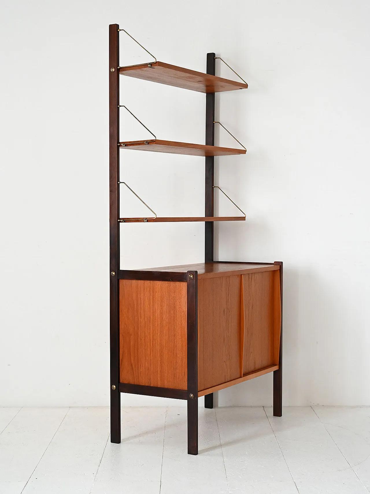 Vintage Scandinavian library with visible shelves and brass tie