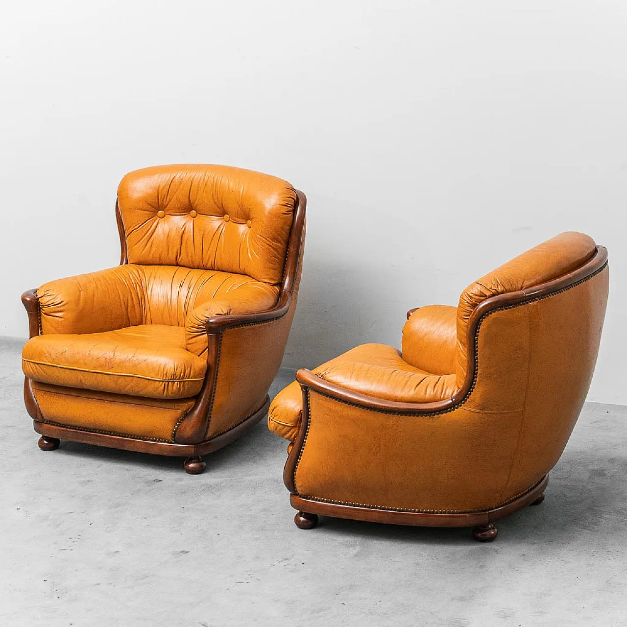 Pair of brown and wood leather armchairs, 50s 1