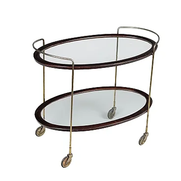 Carrello bar ovale in legno tinto ebano e vetro, anni '50