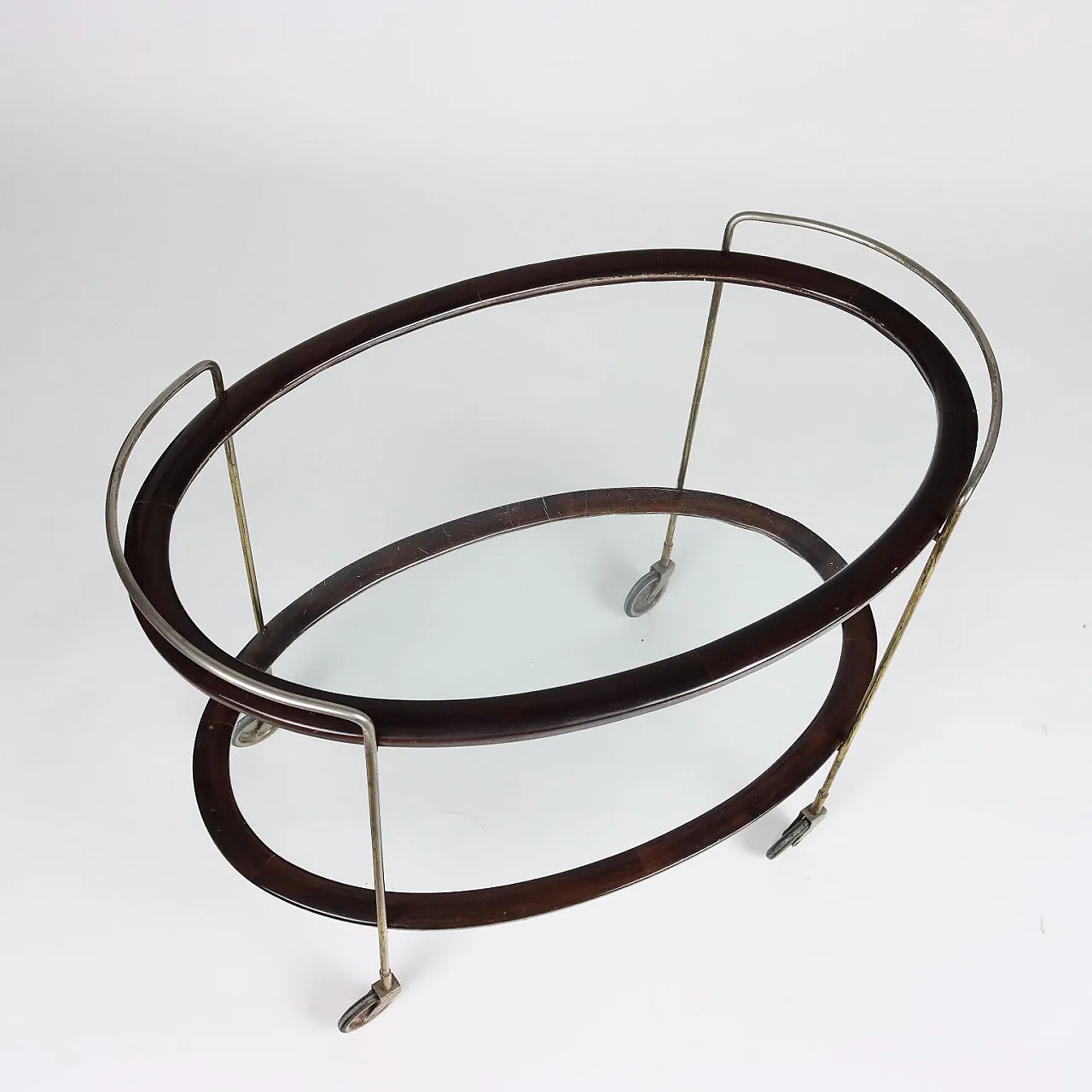 Carrello bar ovale in legno tinto ebano e vetro, anni '50 4