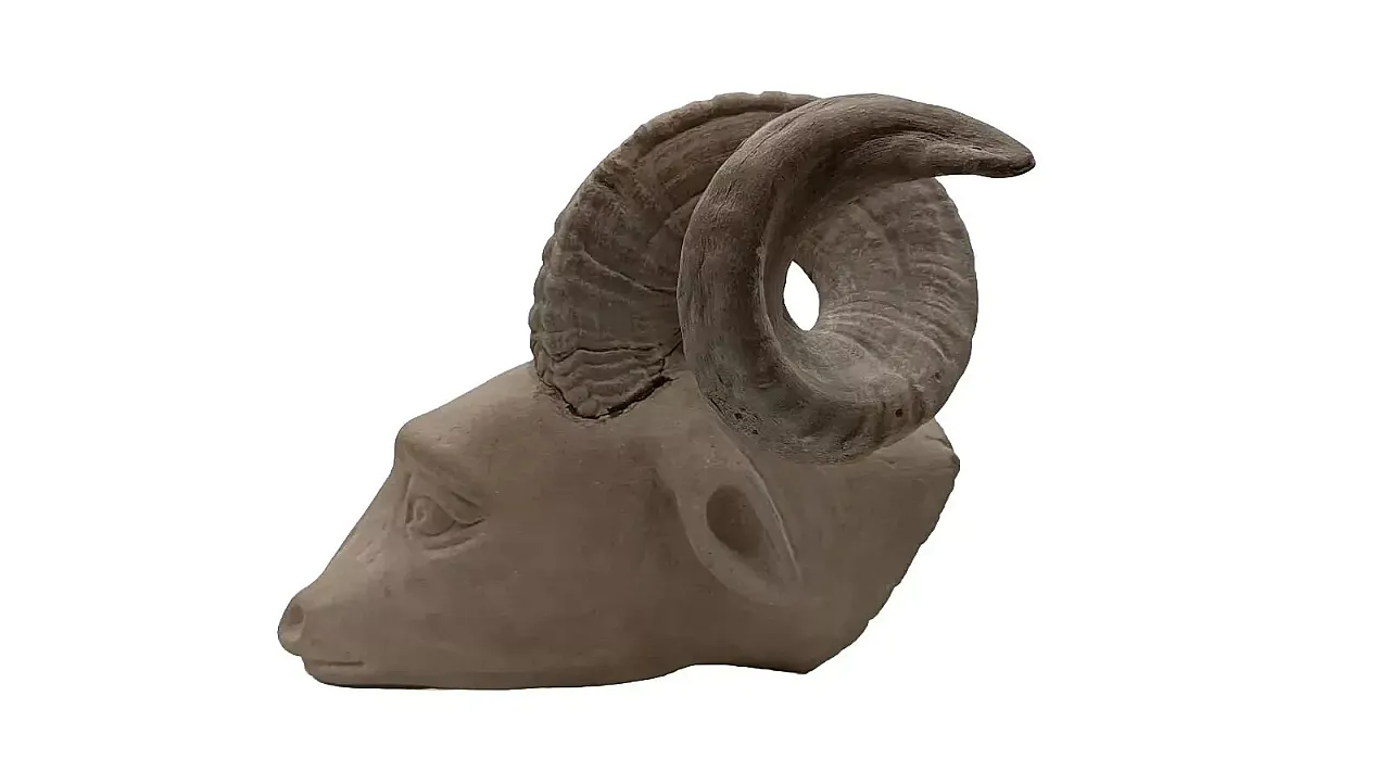 Serene stone hanging sculpture depicting ram head, 20th century 2