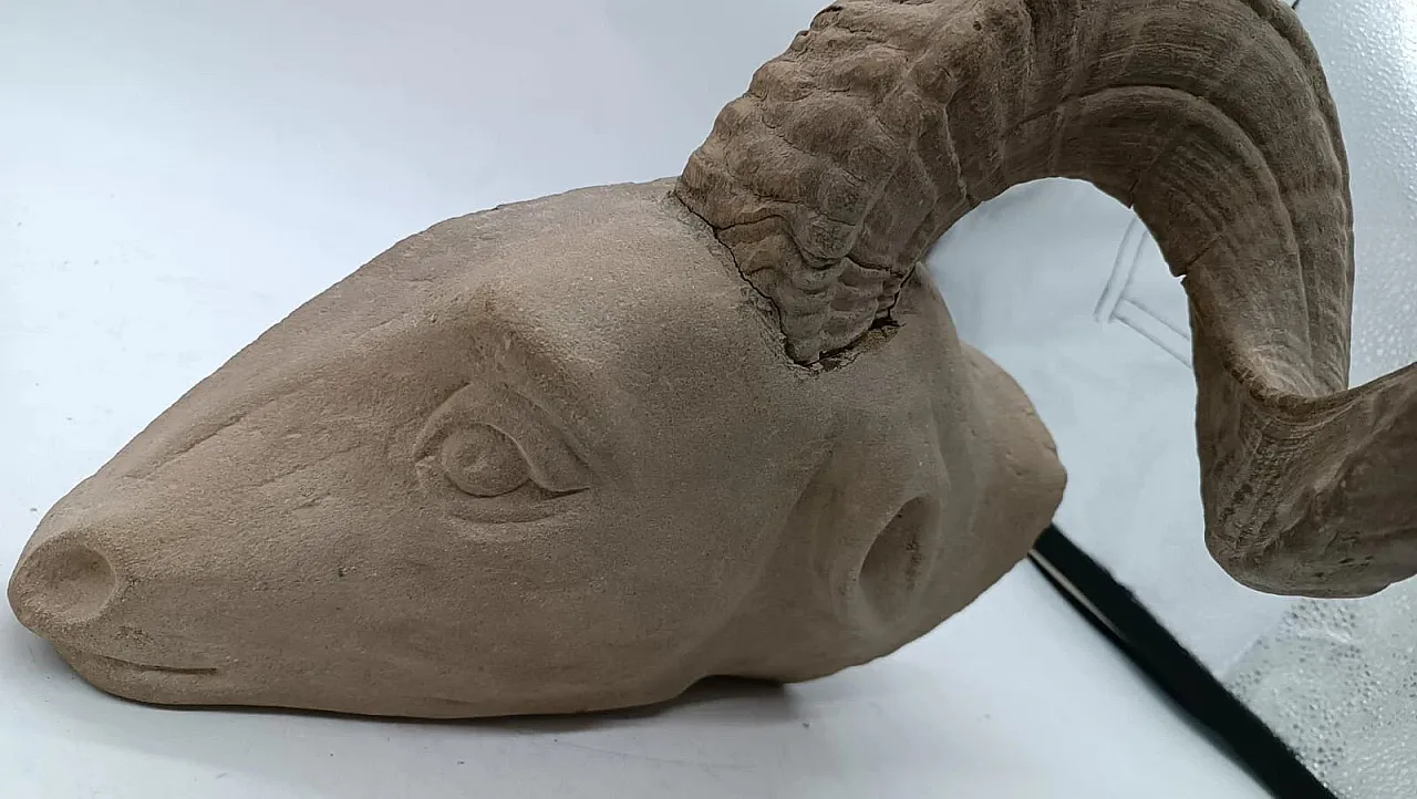 Serene stone hanging sculpture depicting ram head, 20th century 3