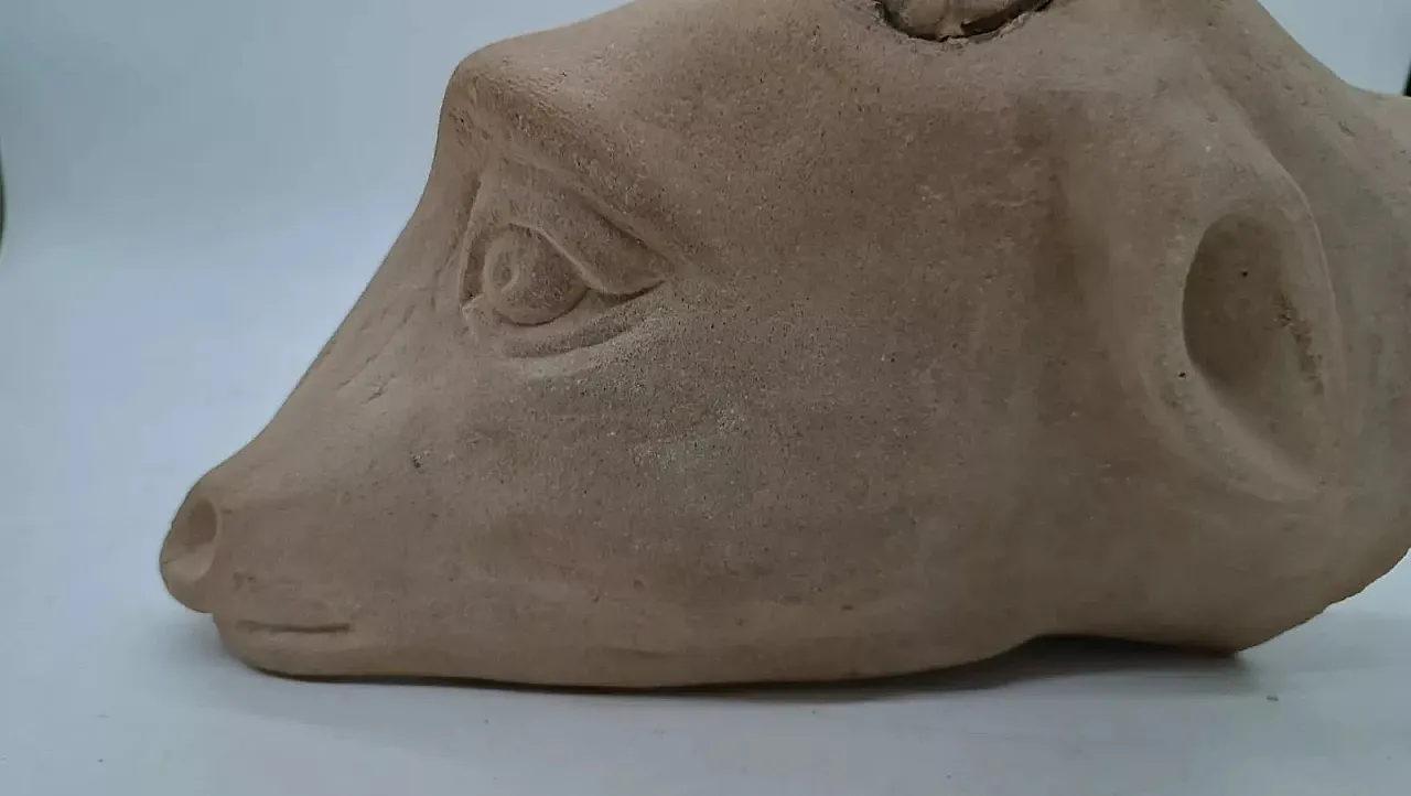 Serene stone hanging sculpture depicting ram head, 20th century 8