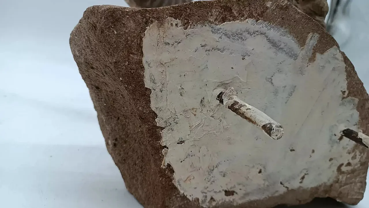 Serene stone hanging sculpture depicting ram head, 20th century 11