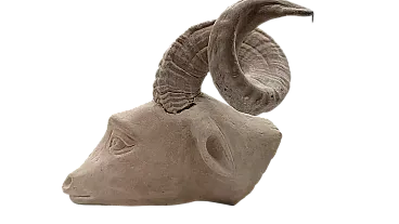Serene stone hanging sculpture depicting ram head, 20th century