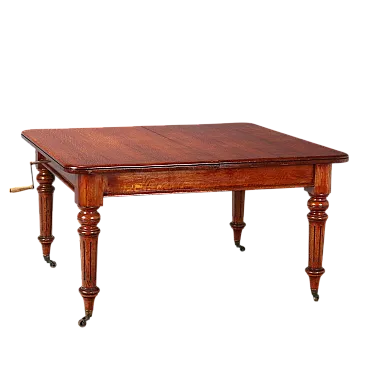 Tavolo in rovere tinto mogano con rotelle in ottone, metà '800