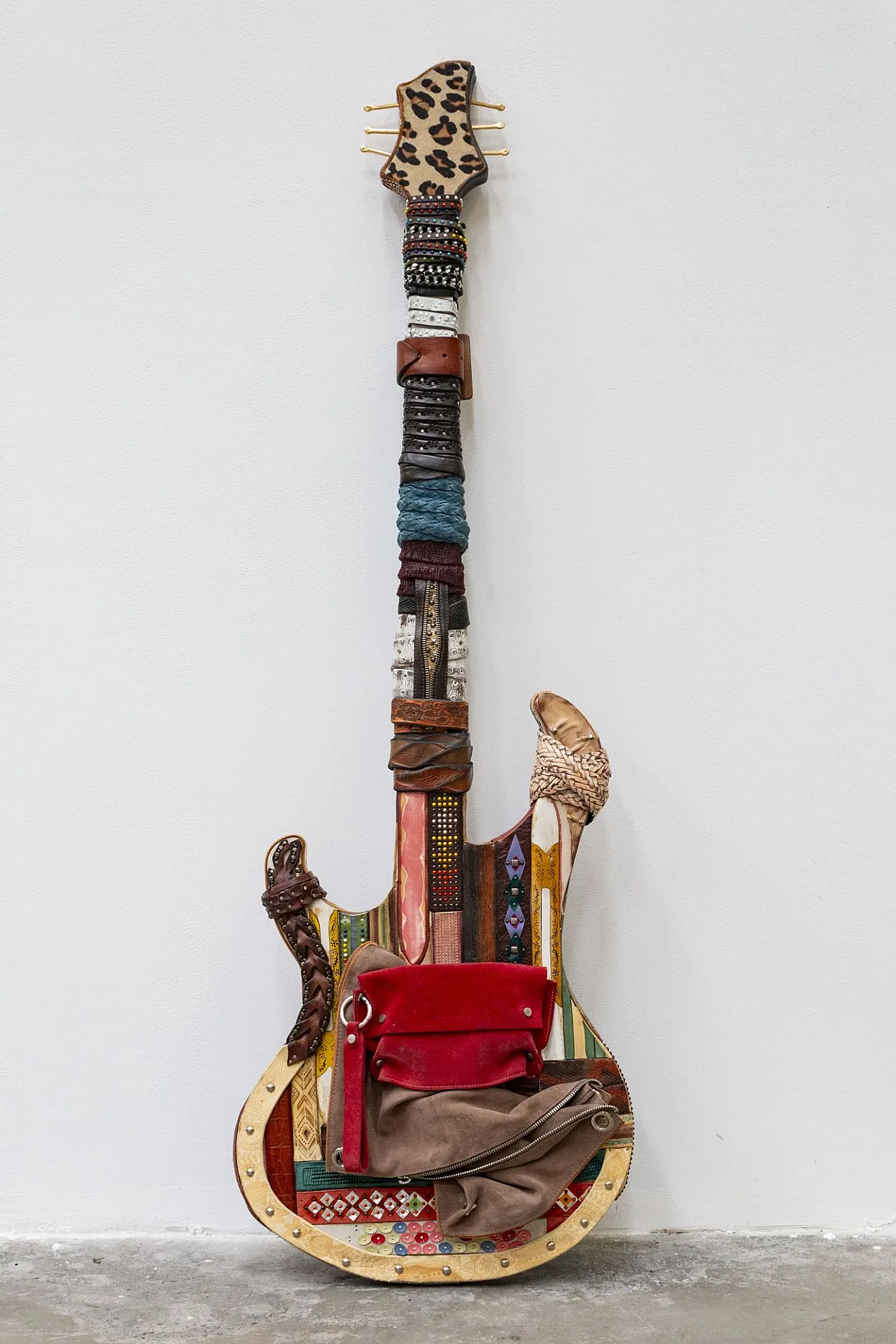 Leather-covered handcrafted guitar, 20th century 1