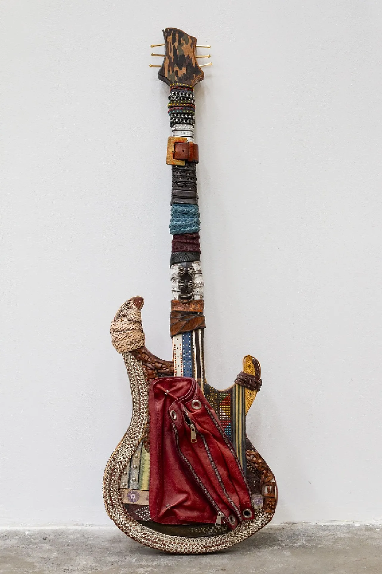 Leather-covered handcrafted guitar, 20th century 4