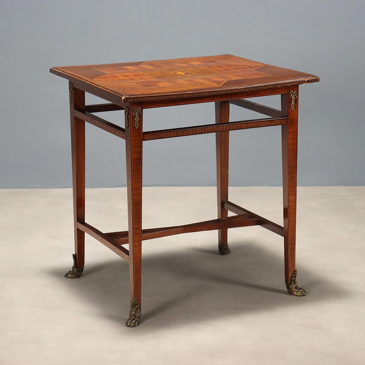 Inlaid and threaded table in various woods and bronze, 19th century 1