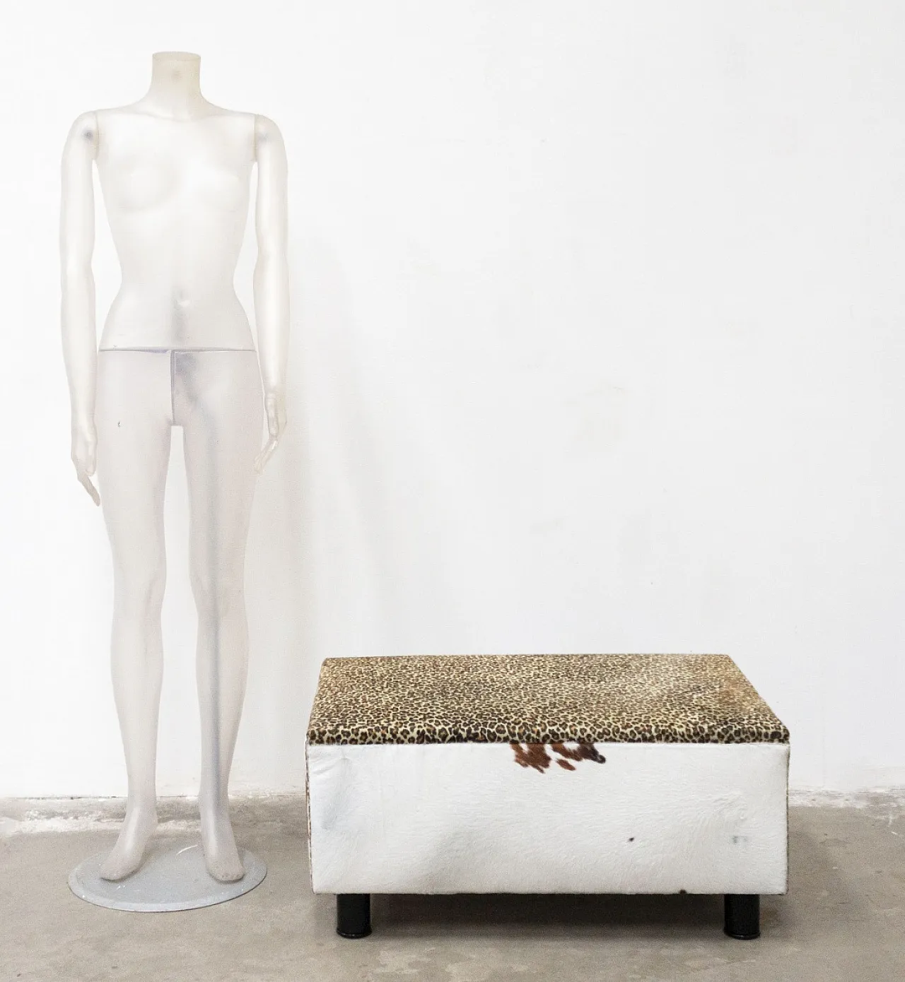 Wooden pouf covered in cowhide, 20th century 1