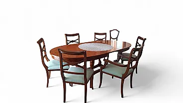 Extendable oval dining table in walnut root with mot inlays, 70s