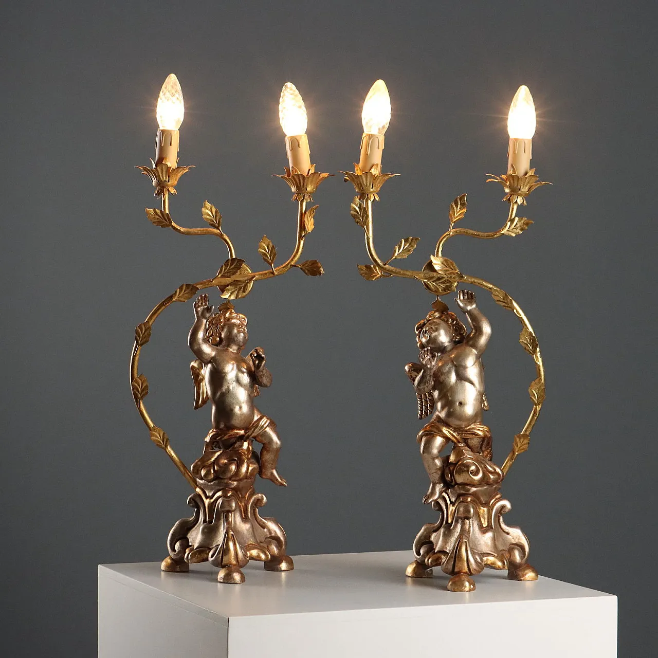 Pair of carved and gilded wooden candlesticks, 20th century 1