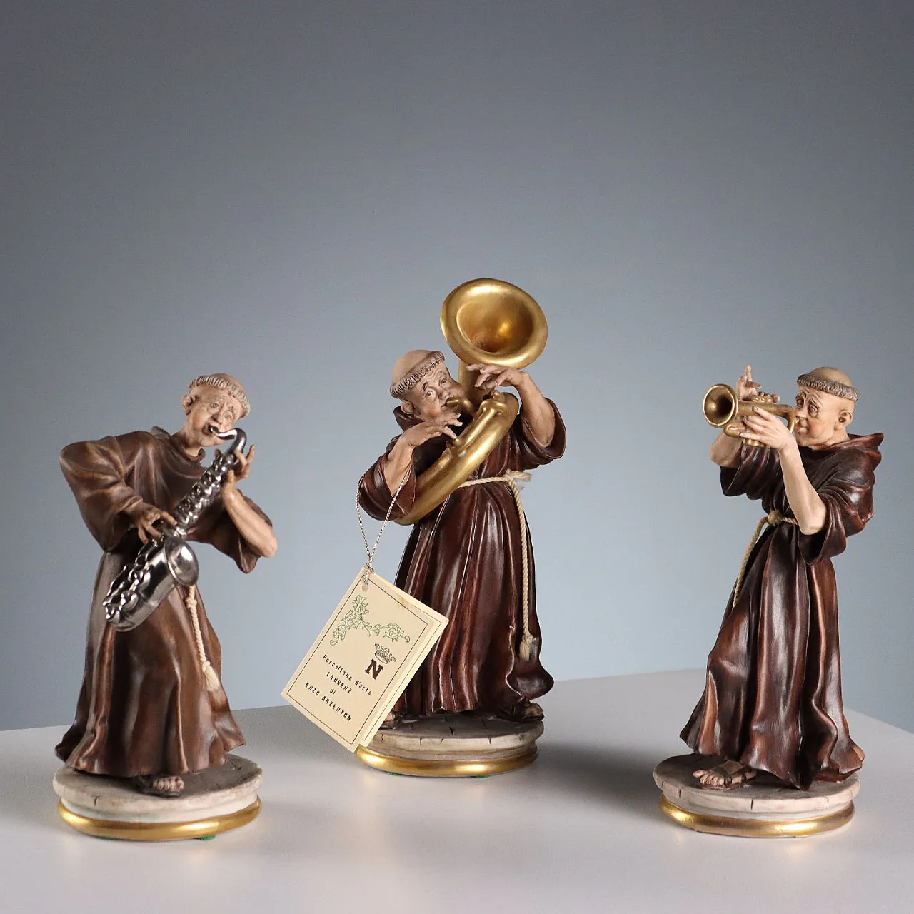 3 Ceramic figures depicting monks playing, 20th century 1