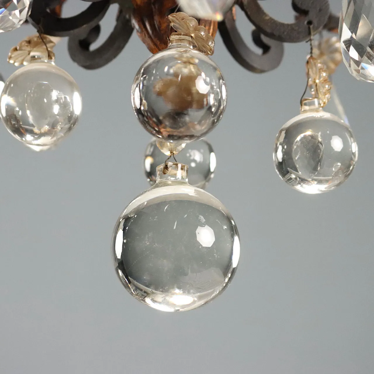 Lampadario a otto luci retto da bracci ricurvi in ferro brunito, '800 9