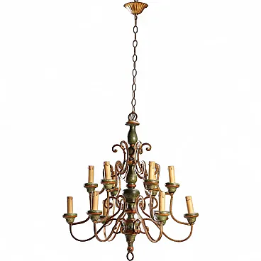 Twelve-light chandelier in curled and gilded iron, 20th century