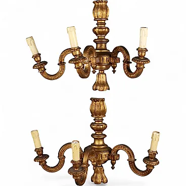 Pair of carved and gilded wooden wall lamps, early 20th century
