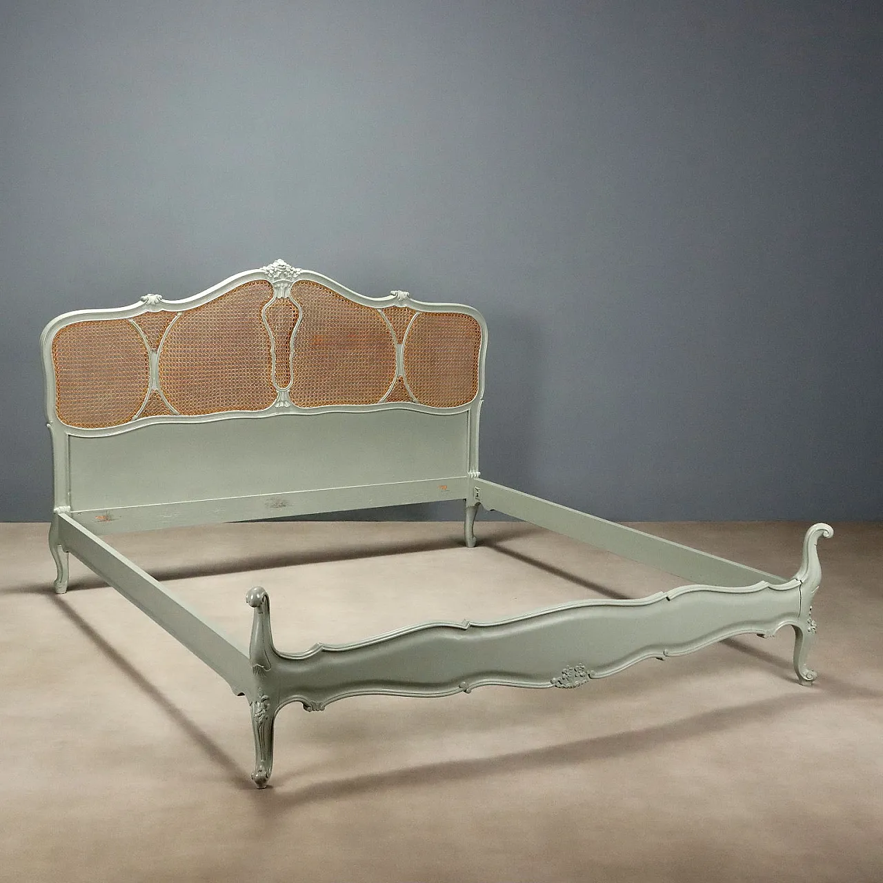 Lacquered double bed with carvings and cane inserts, 20th century 1