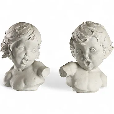 Pair of busts of children, mirrored biscuit sculptures, 20th century
