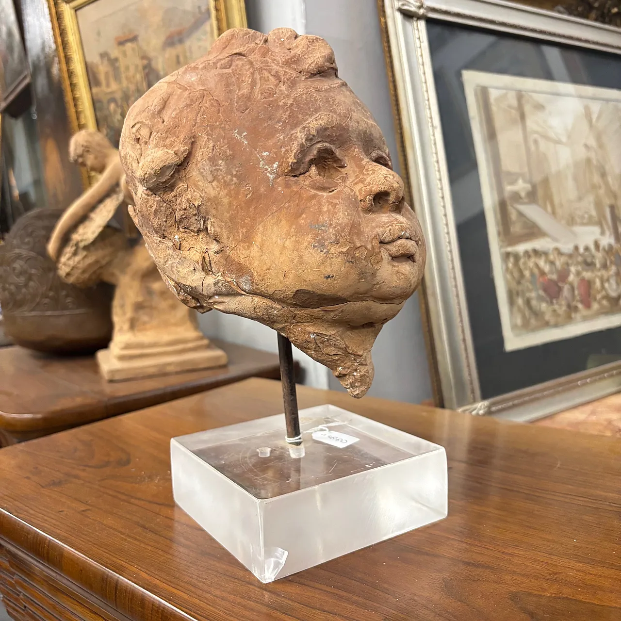 Ancient 19th century terracotta sculpture of the head of an Angel Putto. Size 1