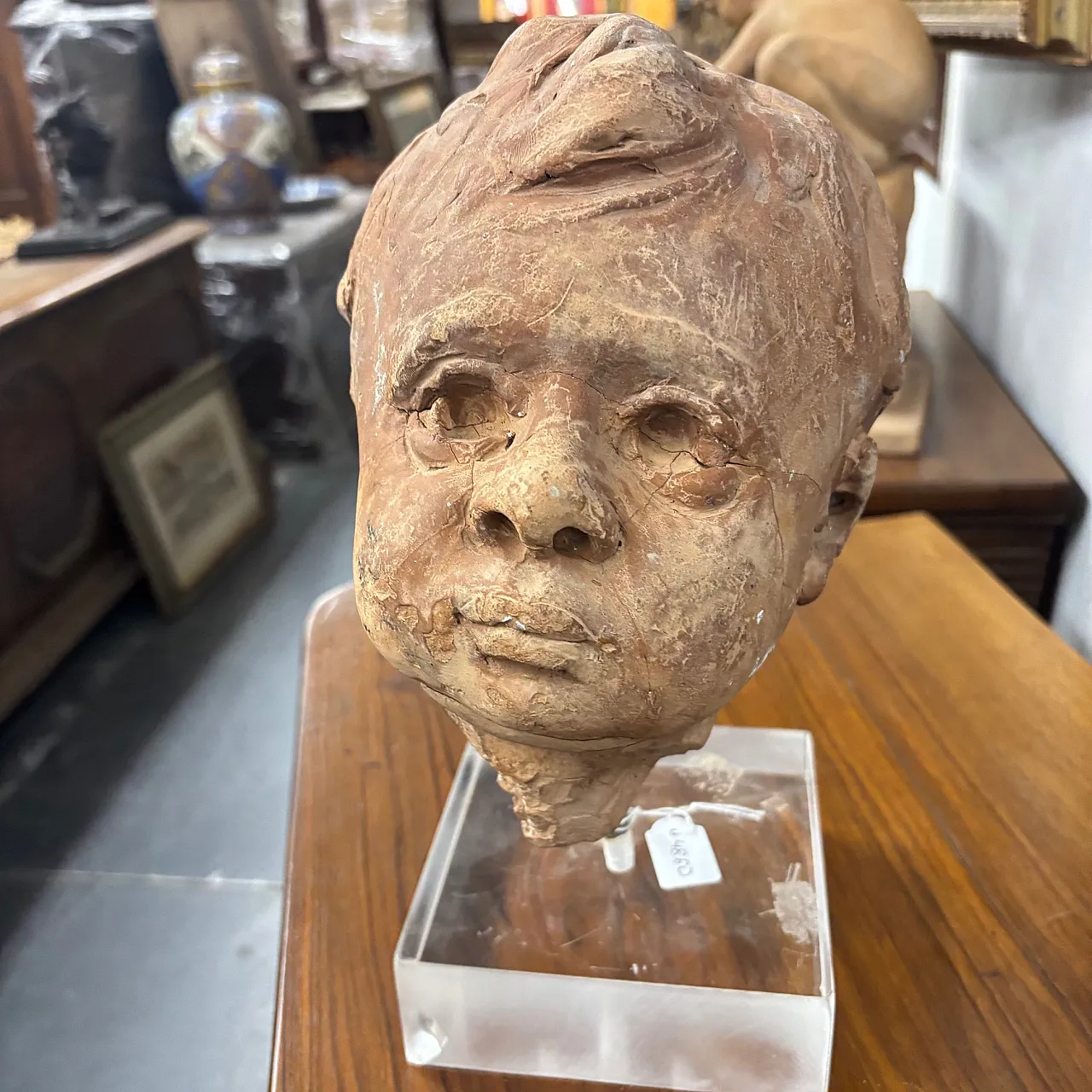 Ancient 19th century terracotta sculpture of the head of an Angel Putto. Size 2