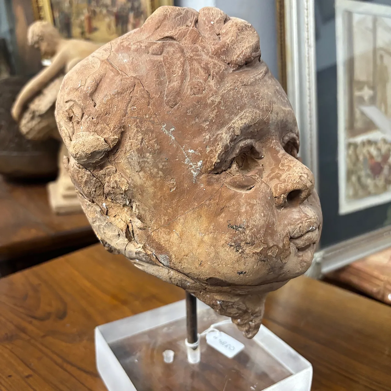 Ancient 19th century terracotta sculpture of the head of an Angel Putto. Size 5