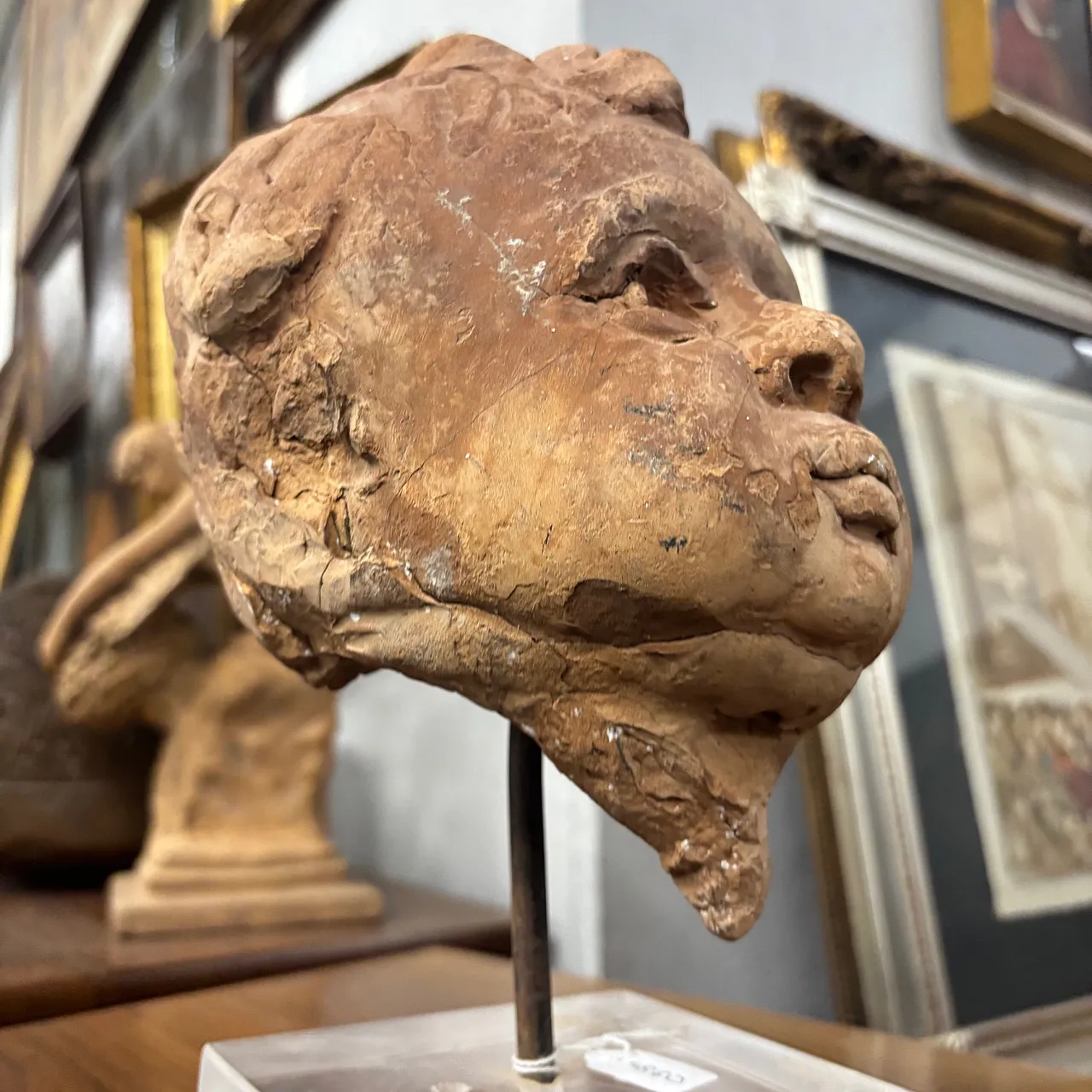 Ancient 19th century terracotta sculpture of the head of an Angel Putto. Size 6