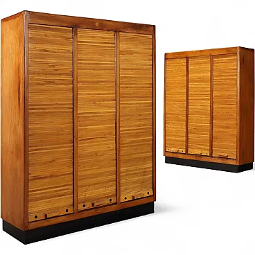 Pair of walnut veneered containers with laminate top, 20th century