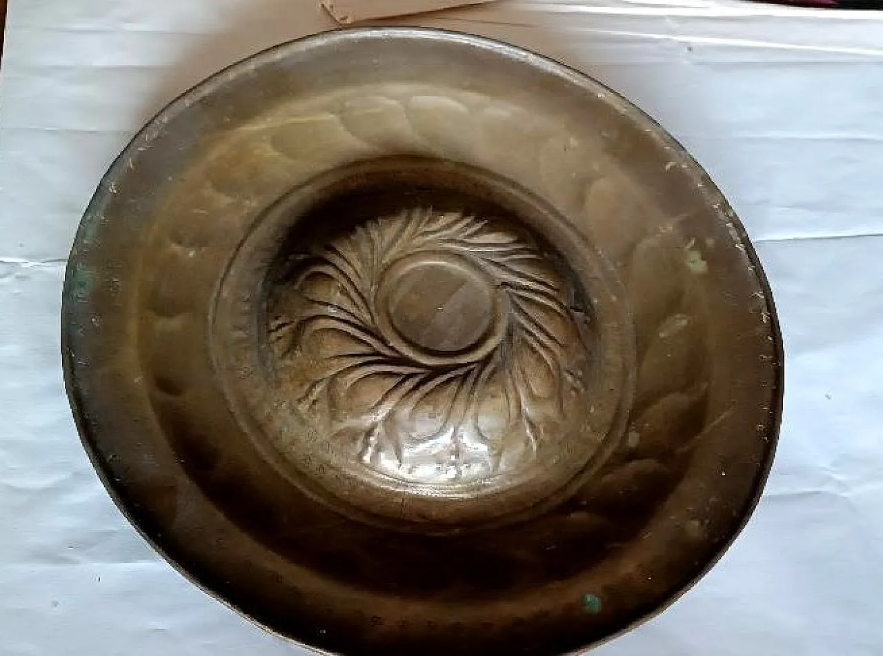 Embossed brass almoner plate, 17th century 9