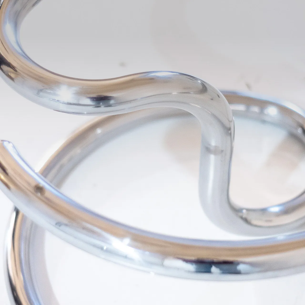 "Cobra" model coffee table by Giotto Stoppino, chromed metal and glass f 12