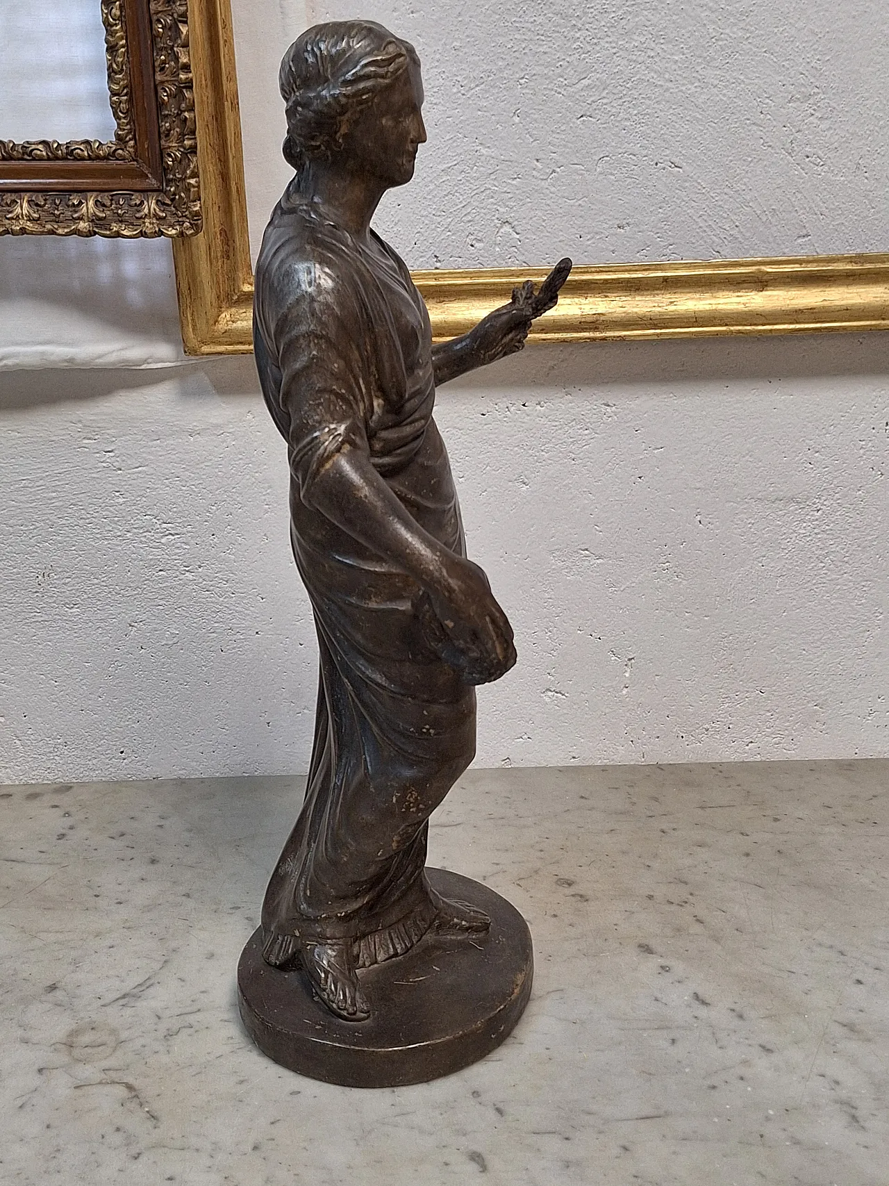 Statue depicting a dressed female figure, 20th century 19