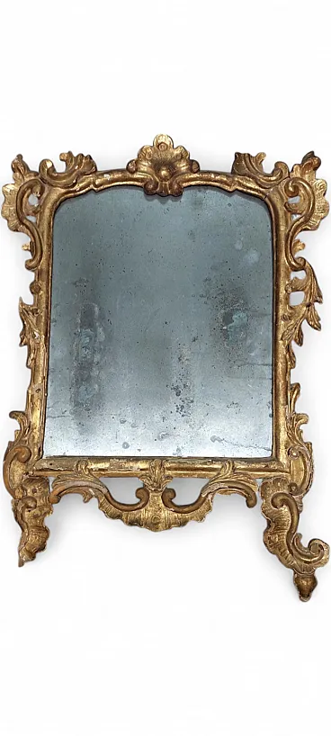 Carved and gilded wooden mirror, early 18th century