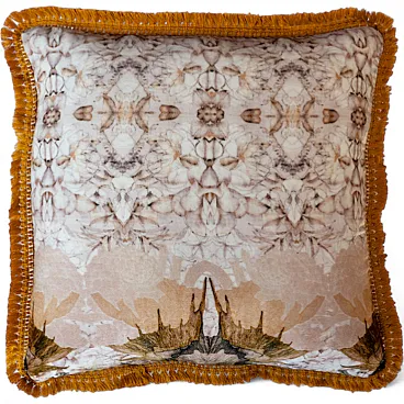 Decorative cushion with ornate pattern and fringes