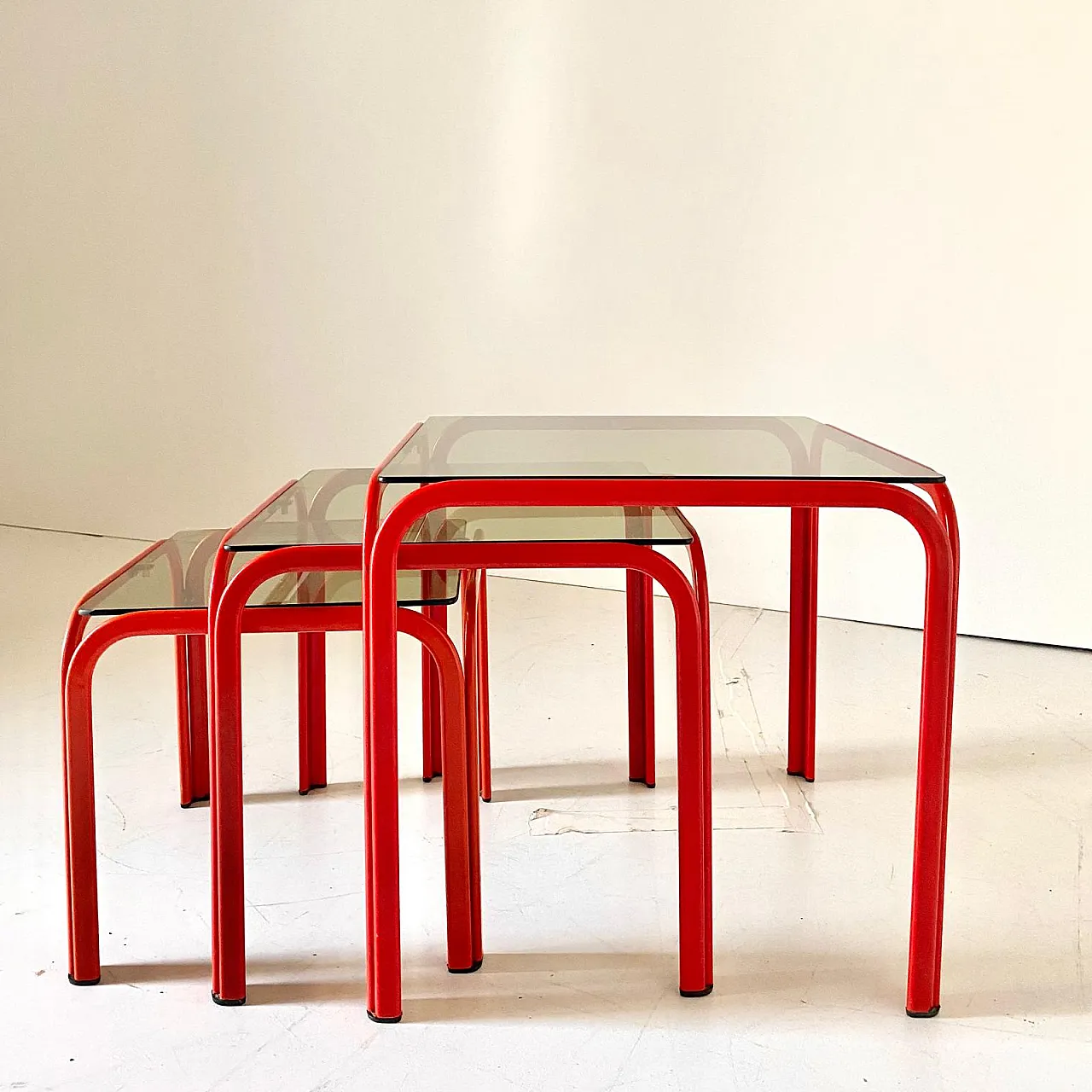 3 red coffee tables with smoked glass, 70s 2