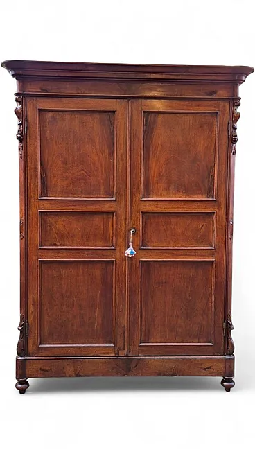Emilian walnut wardrobe with carved garlands, 19th century