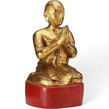 Worshiper in carved and gilded wood, 20th century