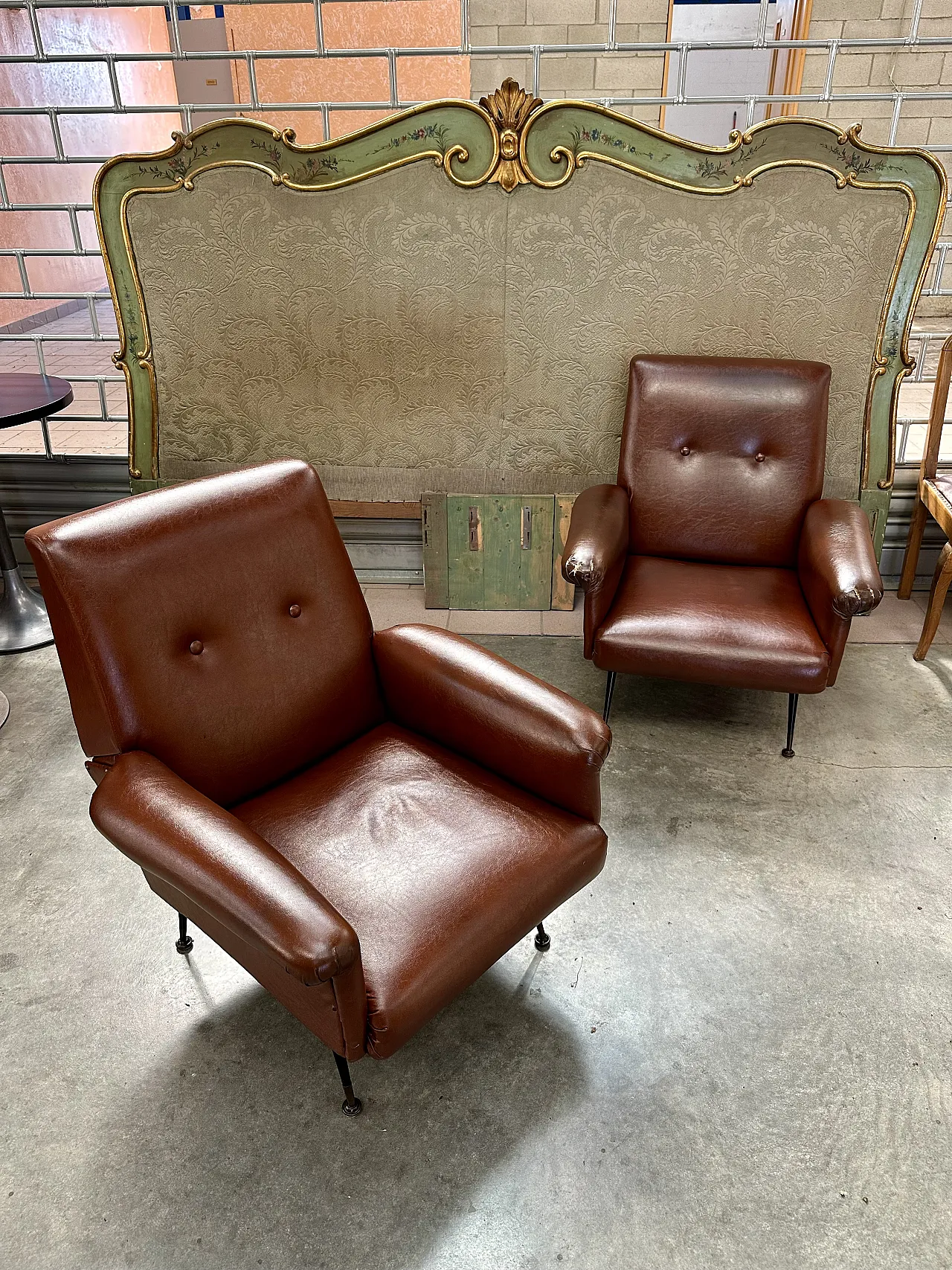 Pair of brown skai armchairs, conical metal feet, Italy, 1950s 1
