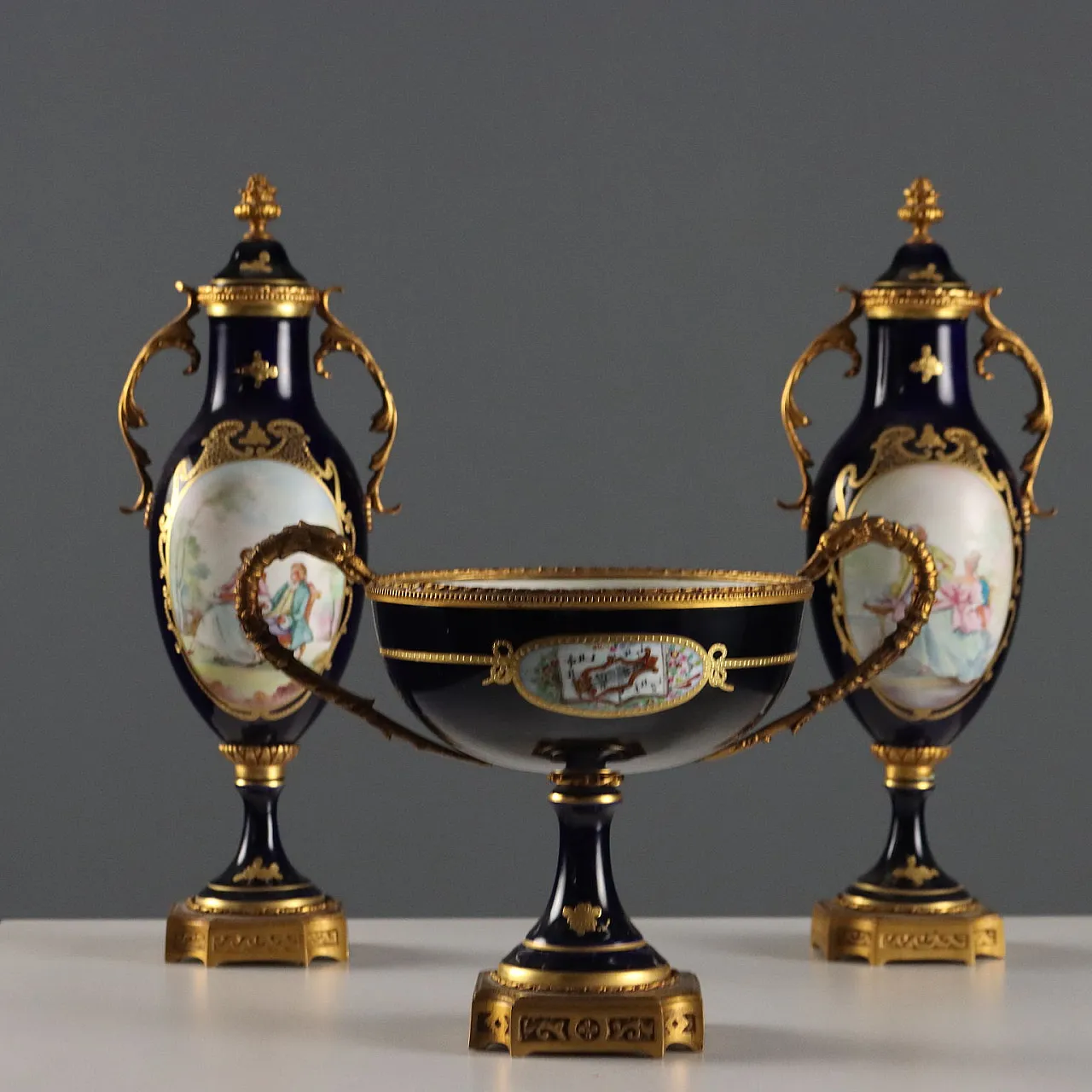 Triptych of porcelain and gilded bronze vases, 20th century 1