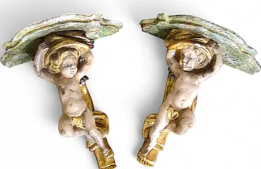 Coppia di mensole in legno intagliato con angeli, inizio '900