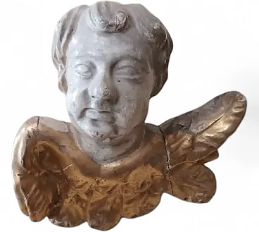 Winged cherub head in lacquered wood, early 18th century
