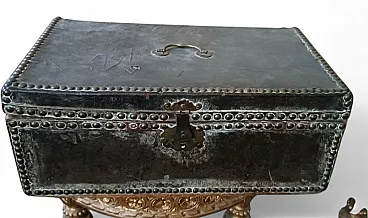Leather-covered wooden trunk decorated with brass studs, 17th century