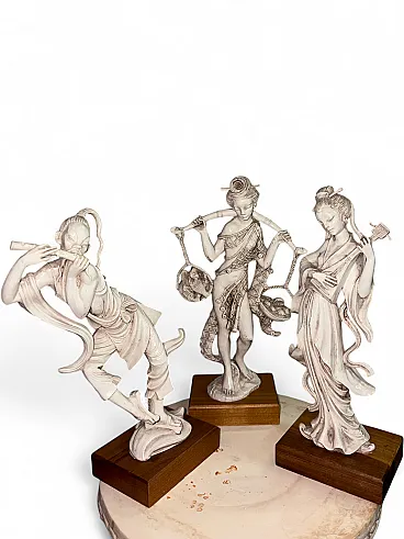 3 Oriental sculptures in plastic and wood, 20th century