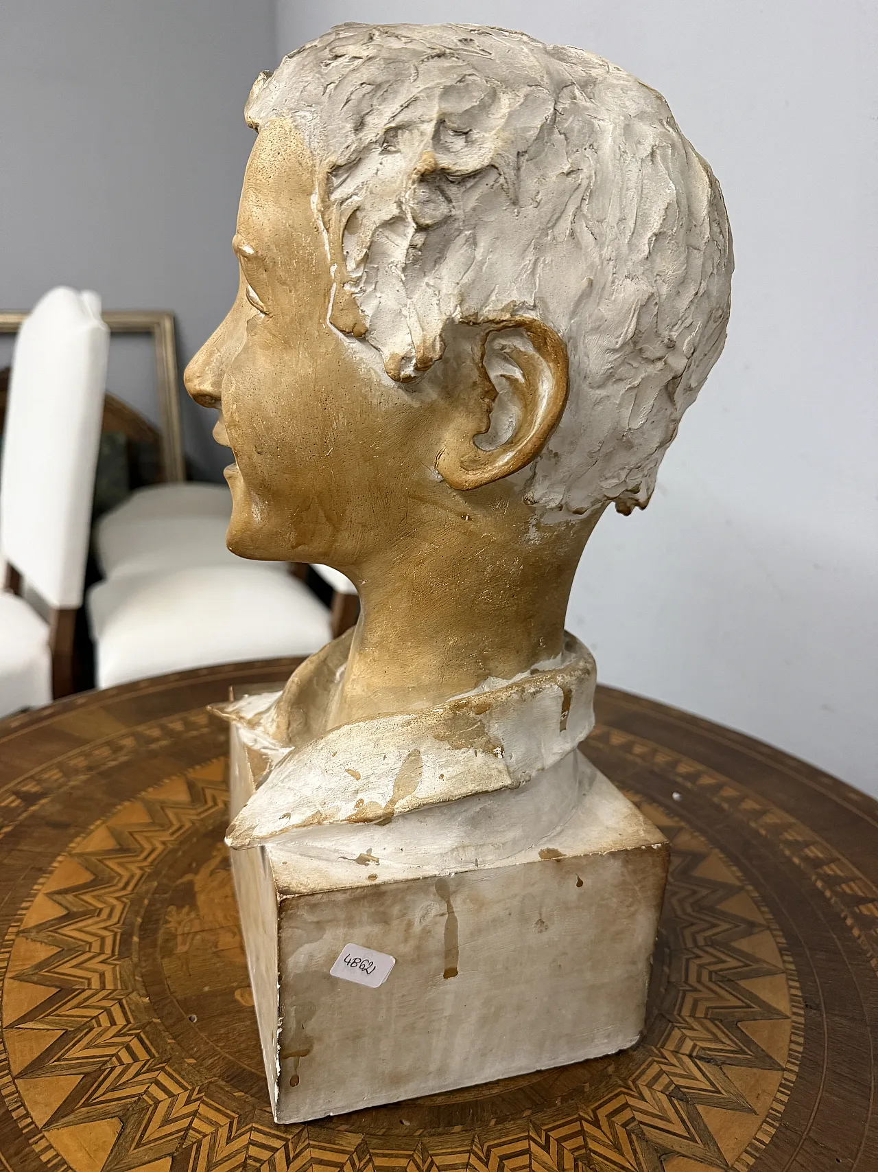 Patinated plaster sculpture of a boy, 1940s 9