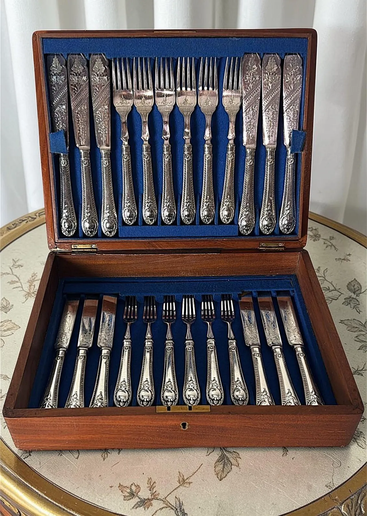 Wooden box with a complete silver-plated flatware, 19th century 18
