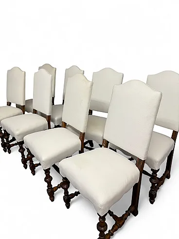 8 walnut chairs with white fabric padding, 19th century